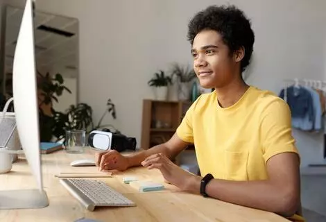 boy studying on computer